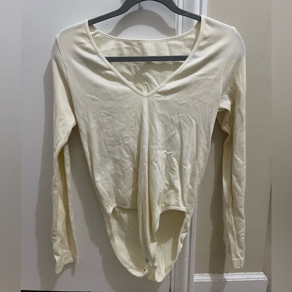 White body suit. No tag for size but fits like a small.